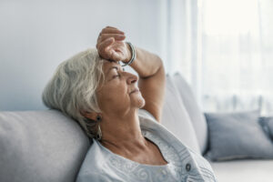 Senior woman experiences fatigue.