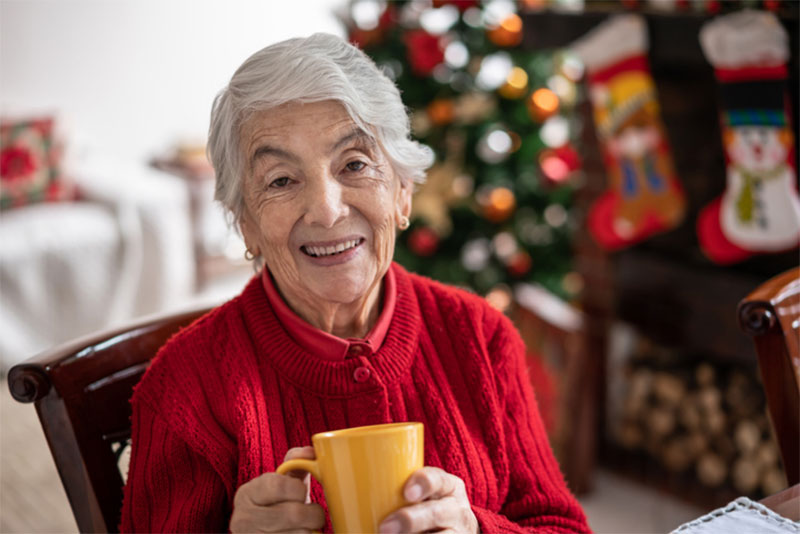 A senior woman enjoys the holidays as home care professionals help her maintain independence and safety.
