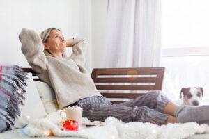 A woman relaxes as she ponders finding balance as a family caregiver in the new year.